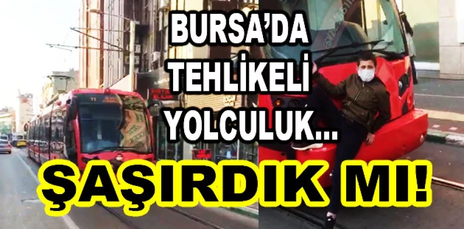 Bursa'da tramvay arkasında tehlikeli yolculuk
