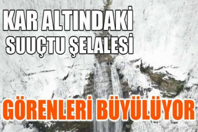 Kar altındaki Suuçtu Şelalesi görenleri büyülüyor