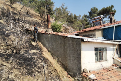 Otluk alanda çıkan yangın eve sıçramadan söndürüldü