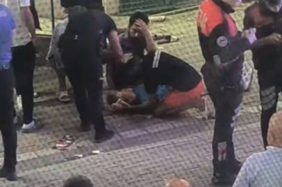 Eşini ayırmaya çalışan kasiyer kadın, demir sopayla dövüldü