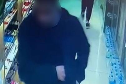 Bin 350 TL değerindeki alkollü içecek şişesini cebine attı, parasını ödemeden gitti