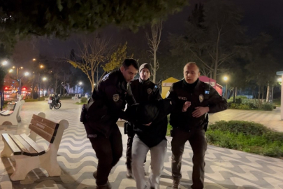 Tartıştığı gencin başında içki şişesini kırdı