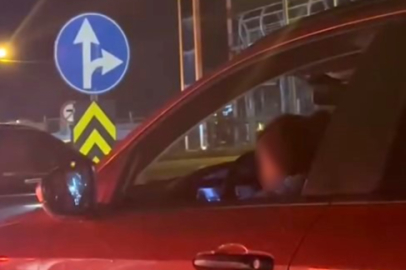 Kucağında çocukla araç kullanan sürücüye tepki yağdı