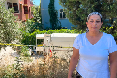 Kum yüklü kamyon yokuşu çıkamayarak apartmanın bahçesine uçtu: 1 ölü